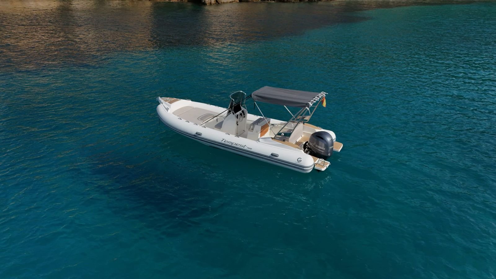 Aerial view of Capelli Tempest 700 anchored in turquoise waters off Puerto de Andratx, Mallorca
